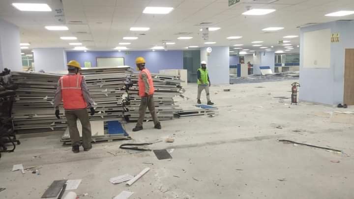 Office dismantling crew removing workstations
